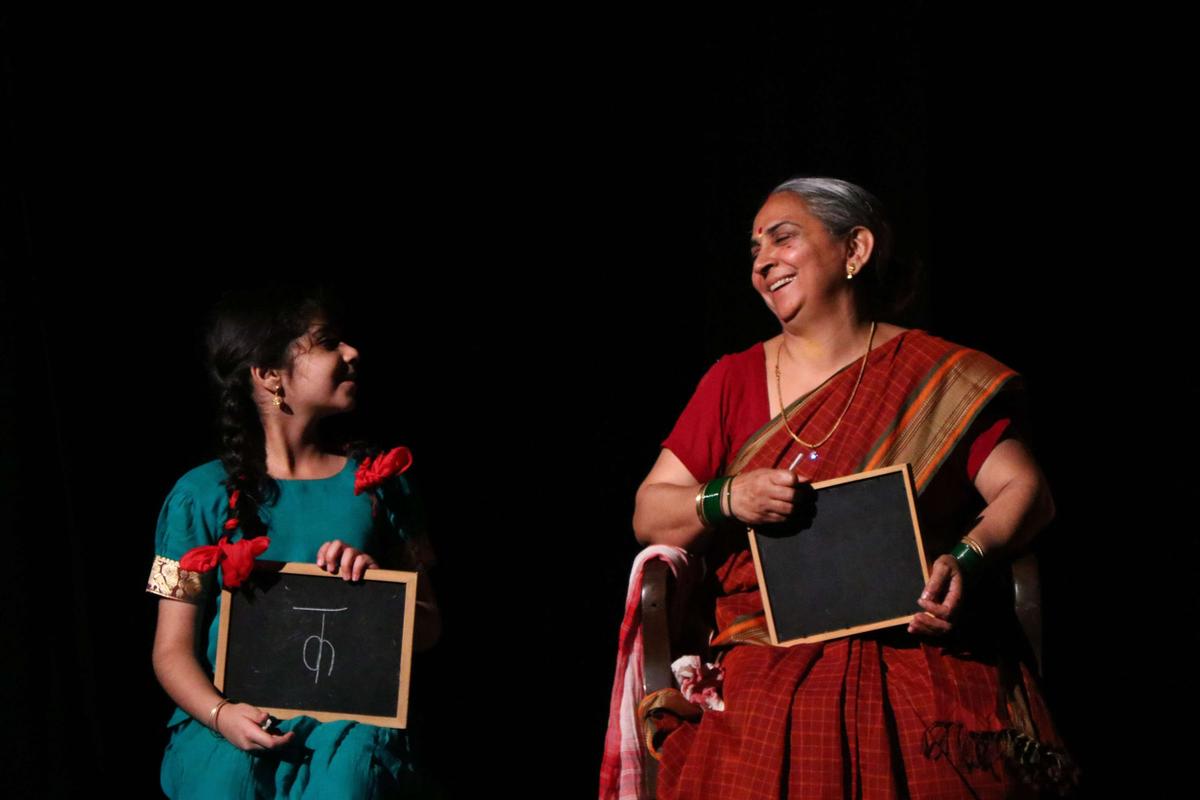 Vijaya learns to read, helped by her grand daughter