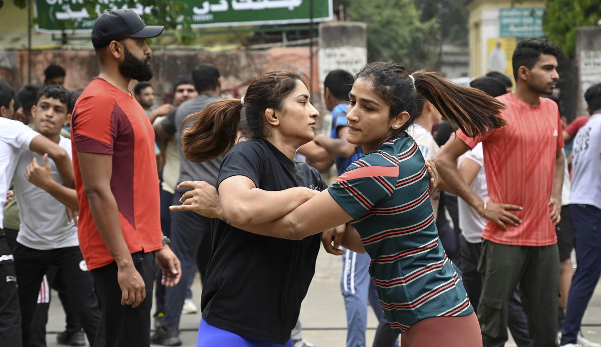 Vinesh Phogat and Sangeeta Phogat practice wrestling as they participate in a protest against WFI president Brij Bhushan Sharan Singh.