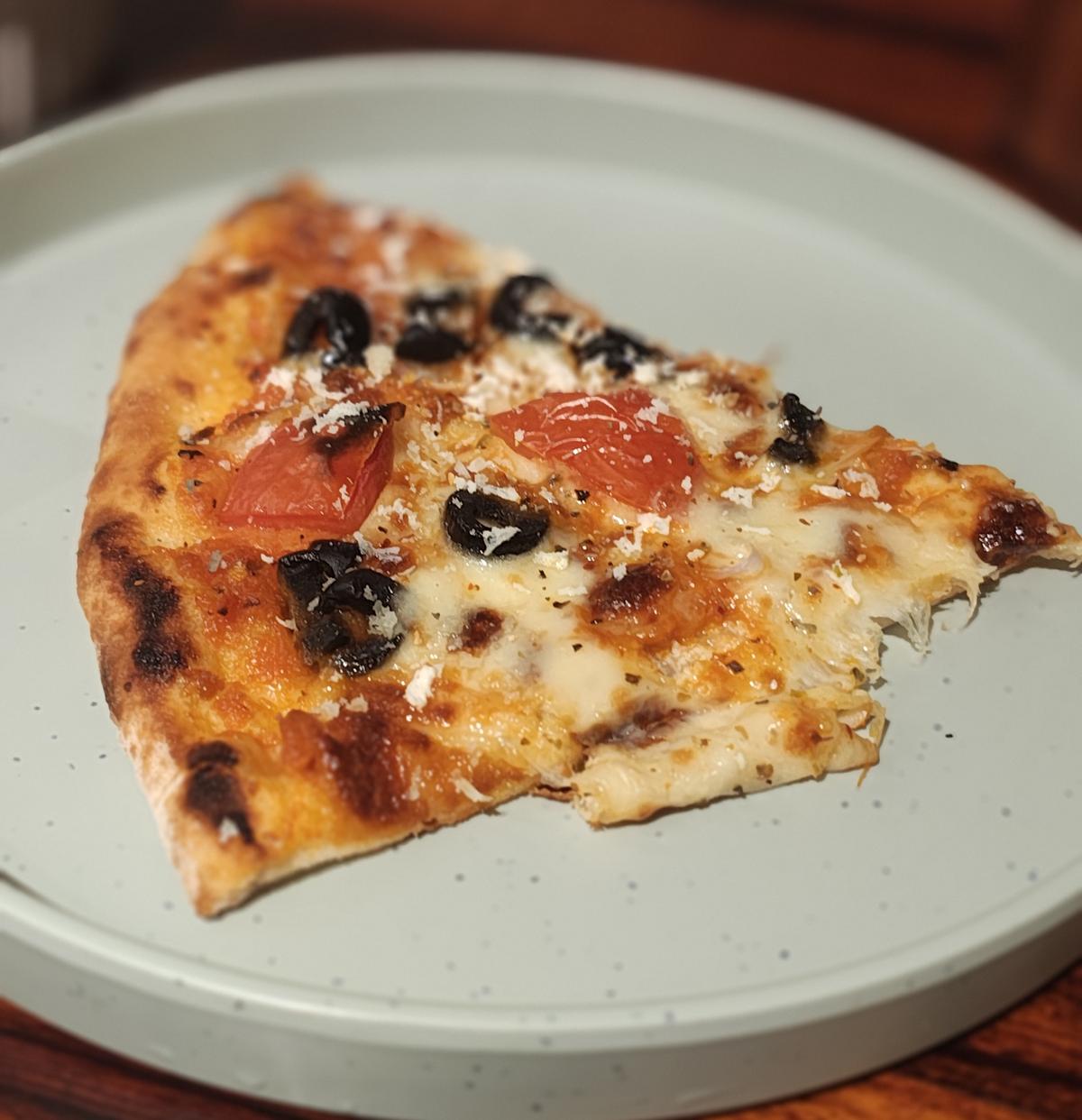 A slice of Mediterranean love pizza from Pizzeria Toto A slice of Mediterranean love pizza from Pizzeria Toto