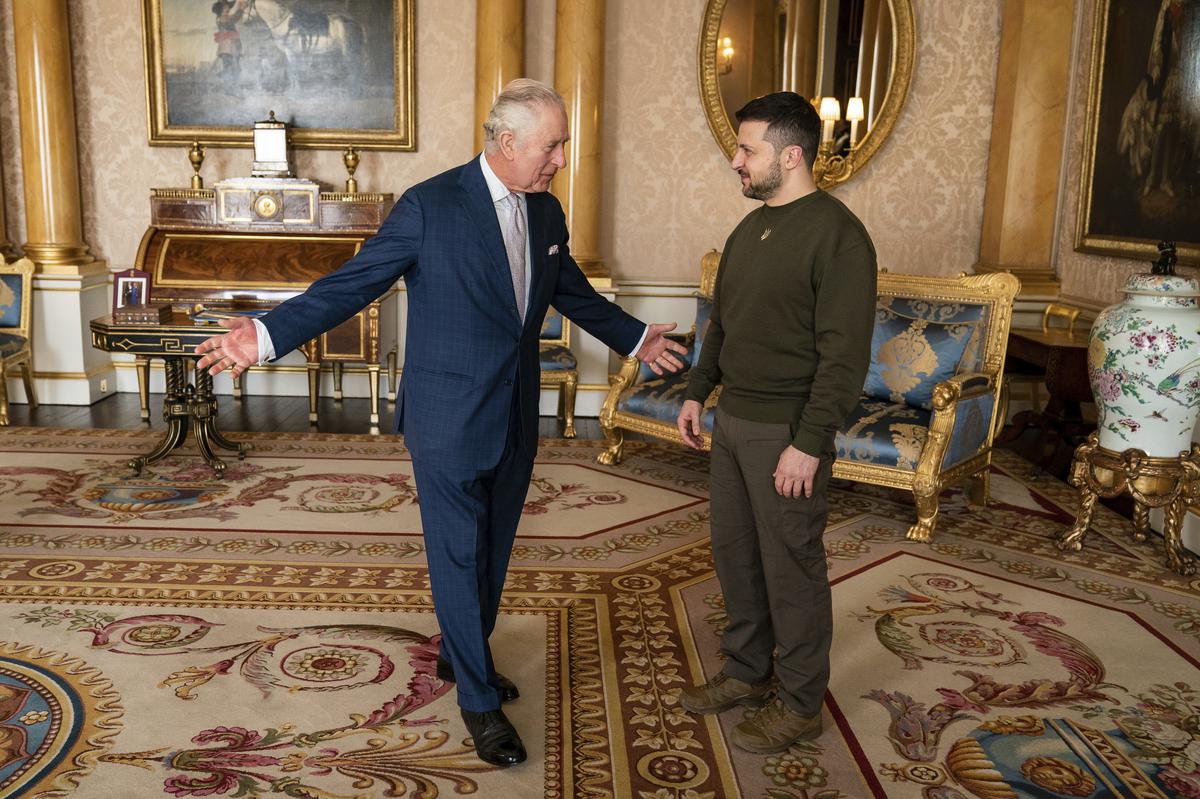 Britain’s King Charles III meets Ukrainian President Volodymyr Zelenskyy at the Buckingham Palace on February 8, 2023. 