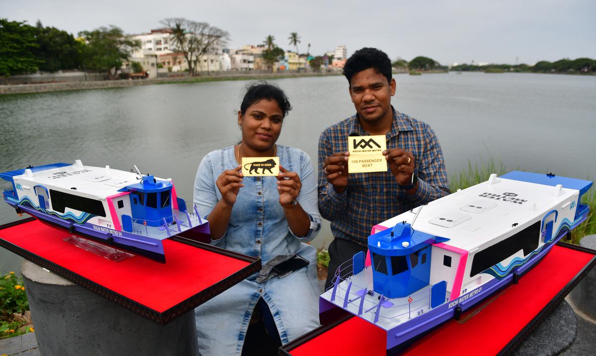 Queenthunk Amalanathan F and his wife Advina
Jerling with miniature models of Kochi Water Metro carrier