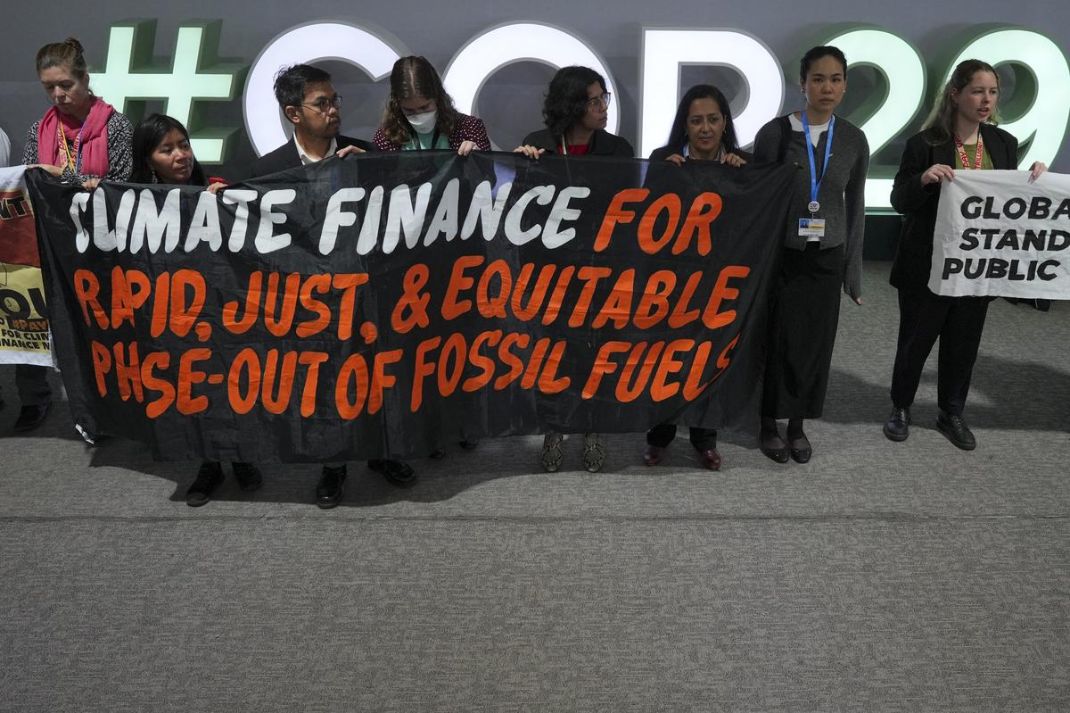 Activists participate in a demonstration for climate finance at the COP29 U.N. Climate Summit in Baku, Azerbaijan on November 21, 2024.