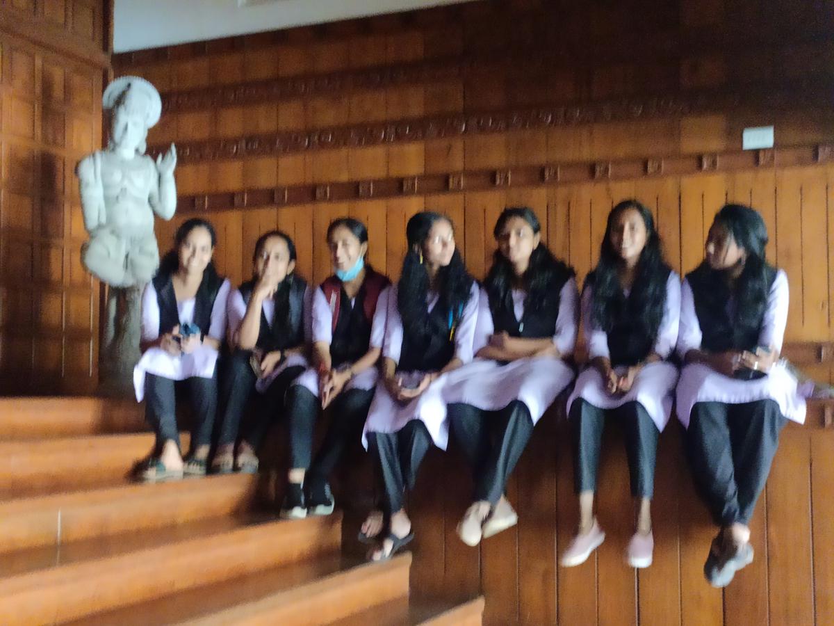 Students of Nalanda Teachers Training Institute outside the visitors' gallery waiting for a chance to go inside the gallery.