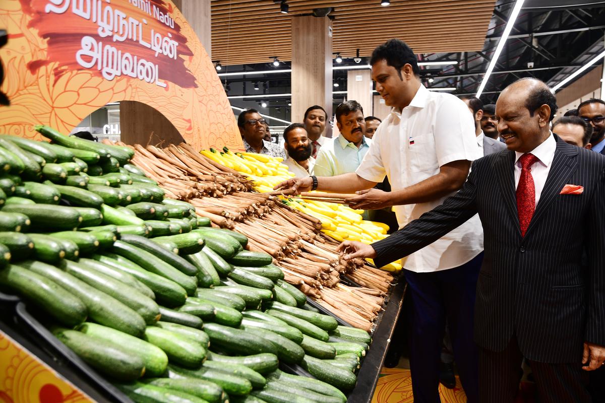 Industry, Investment and Commerce Minister TRB Raja (second right) and MA Yusuf Ali, Chairman and Managing Director of Lulu Group, showcasing fresh produce directly from farmers in and around the Coimbatore belt