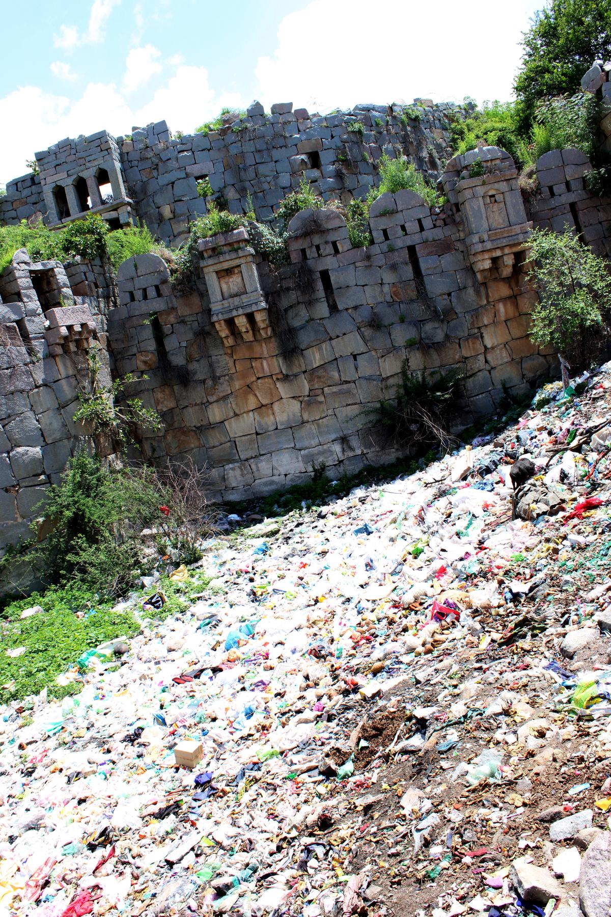 Garbage and plastic waste in the moat around the Mudgal Fort.