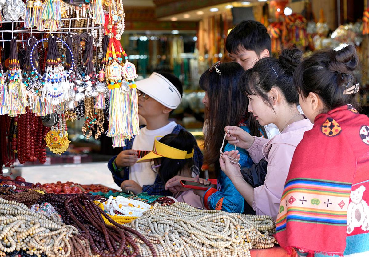 Tourists shop for souvenirs on Barkhor Street in Lhasa. 