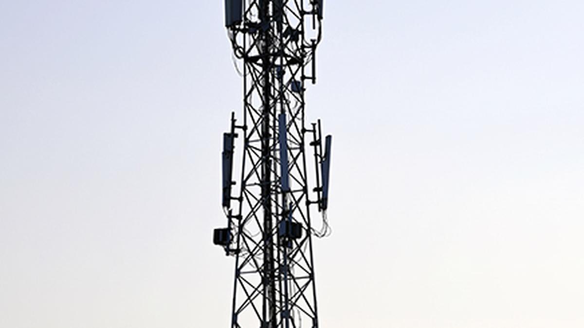 Slum dwellers in Mumbai protest installation of mobile towers, briefly stop local train