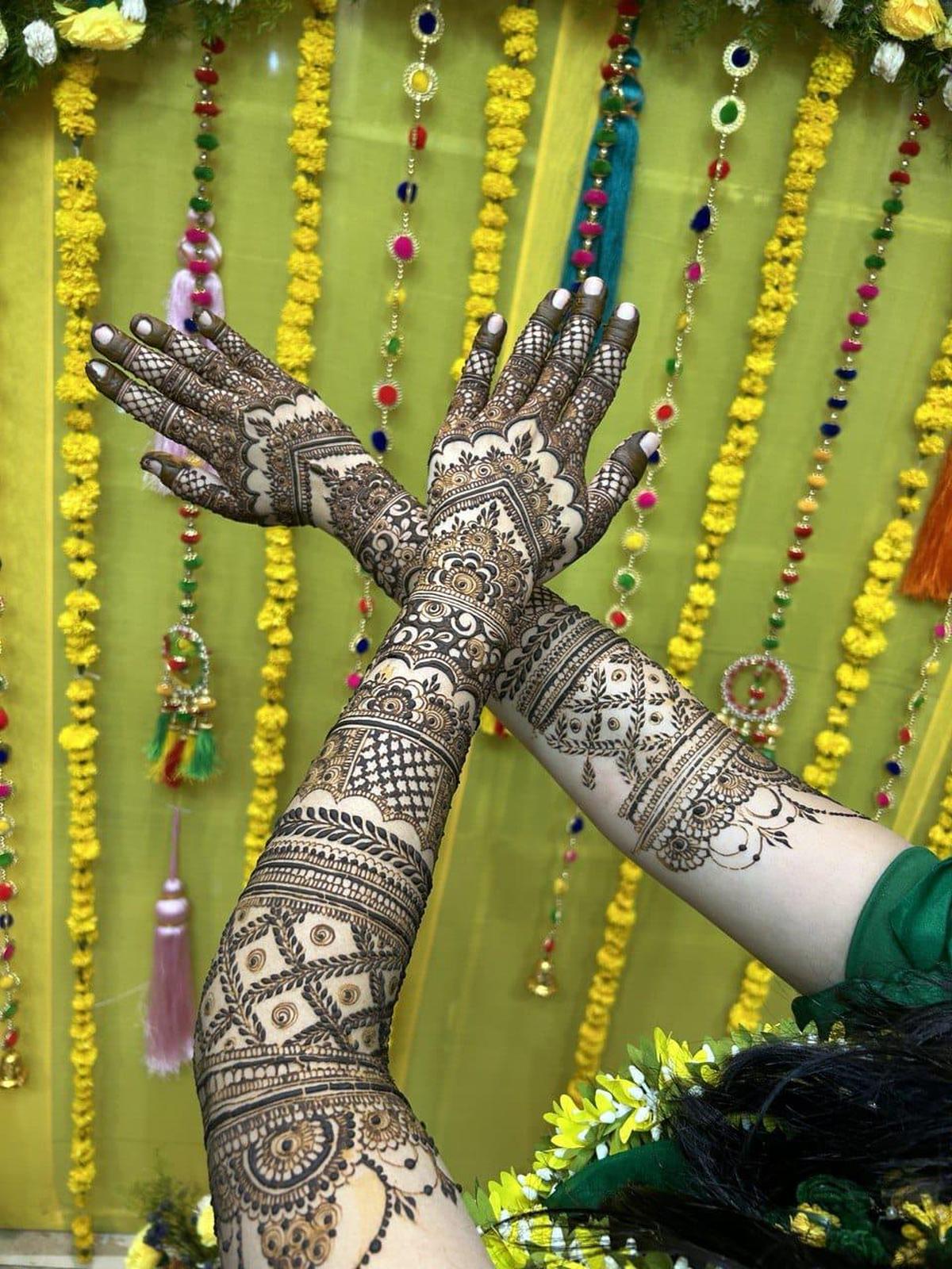 Young women showcase their mehendi artistry. Young women showcase their mehendi artistry.