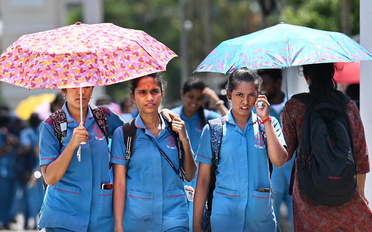 With the temperatures soaring up, college students seen using umbrellas to shield themselves from the scorching sun at Stanley viaduct near Chennai Central station.
