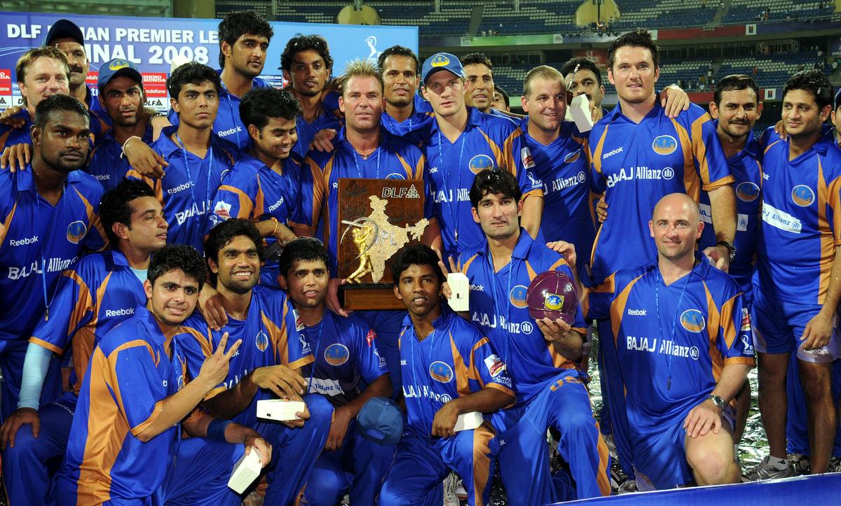 Rajasthan Royals team members pose with the trophy after winning the DLF Indian Premier League Twenty20 cricket tournament held at the D.Y. Patil Stadium in Mumbai on June 1, 2008. 