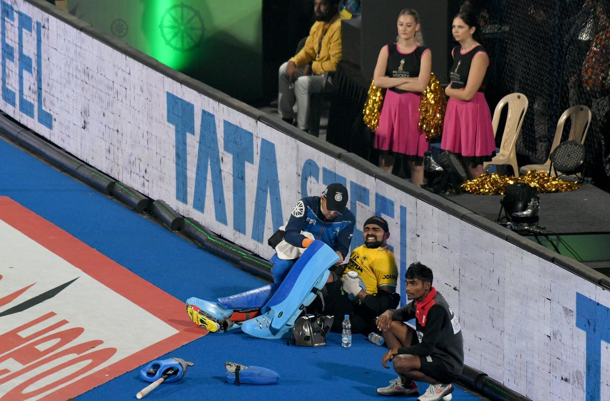 India  goalkeeper P.R. Shreejesh sits out injured during the shootout against New Zealand during the FIH Men’s Hockey World Cup 2023 crossover match at the Kalinga hockey stadium in Bhubaneswar on January 22, 2023.