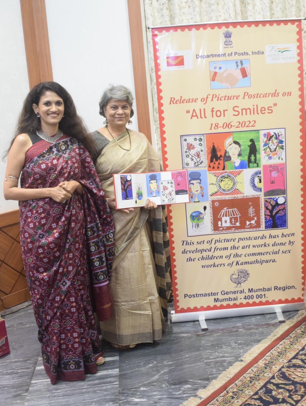 Swati Pandey, Postmaster General of Mumbai region, with the postcards based on paintings by 10 children from Kamathipura, Mumbai, which were released by India Post, Mumbai. 