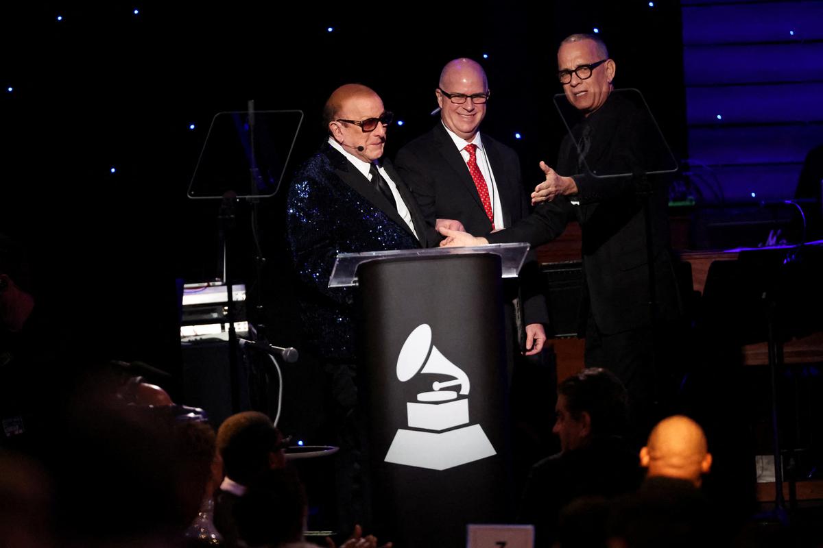 Tom Hanks and Clive Davis speak on stage at the Pre-GRAMMY gala, hosted by the Recording Academy and Clive Davis, in Beverly Hills, California, February 3, 2024.