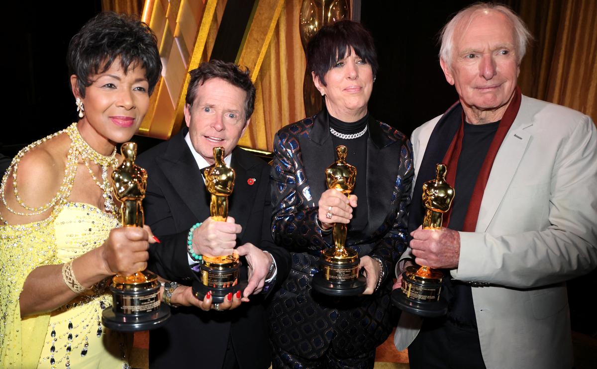 Director Euzhan Palcy, actor Michael J. Fox, songwriter Diane Warren and director Peter Weir pose with their honorary Oscar during the 13th Governors Awards in Los Angeles, California, U.S., November 19, 2022.