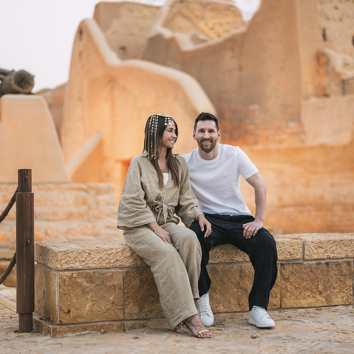 Fooballer Lionel Messi, who is a tourism ambassador for Saudi Arabia, poses for a promotional shoot with his wife. 