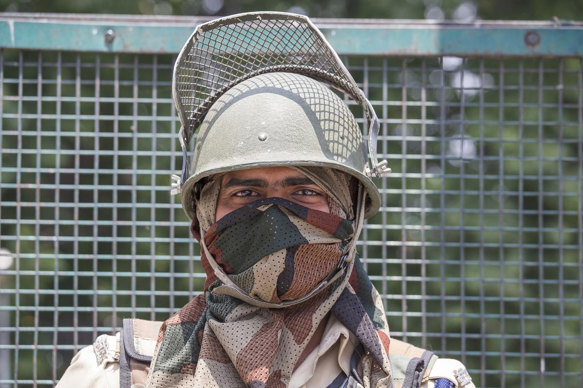 A guard at an Indian Army checkpoint in Kashmir. A guard at an Indian Army checkpoint in Kashmir.