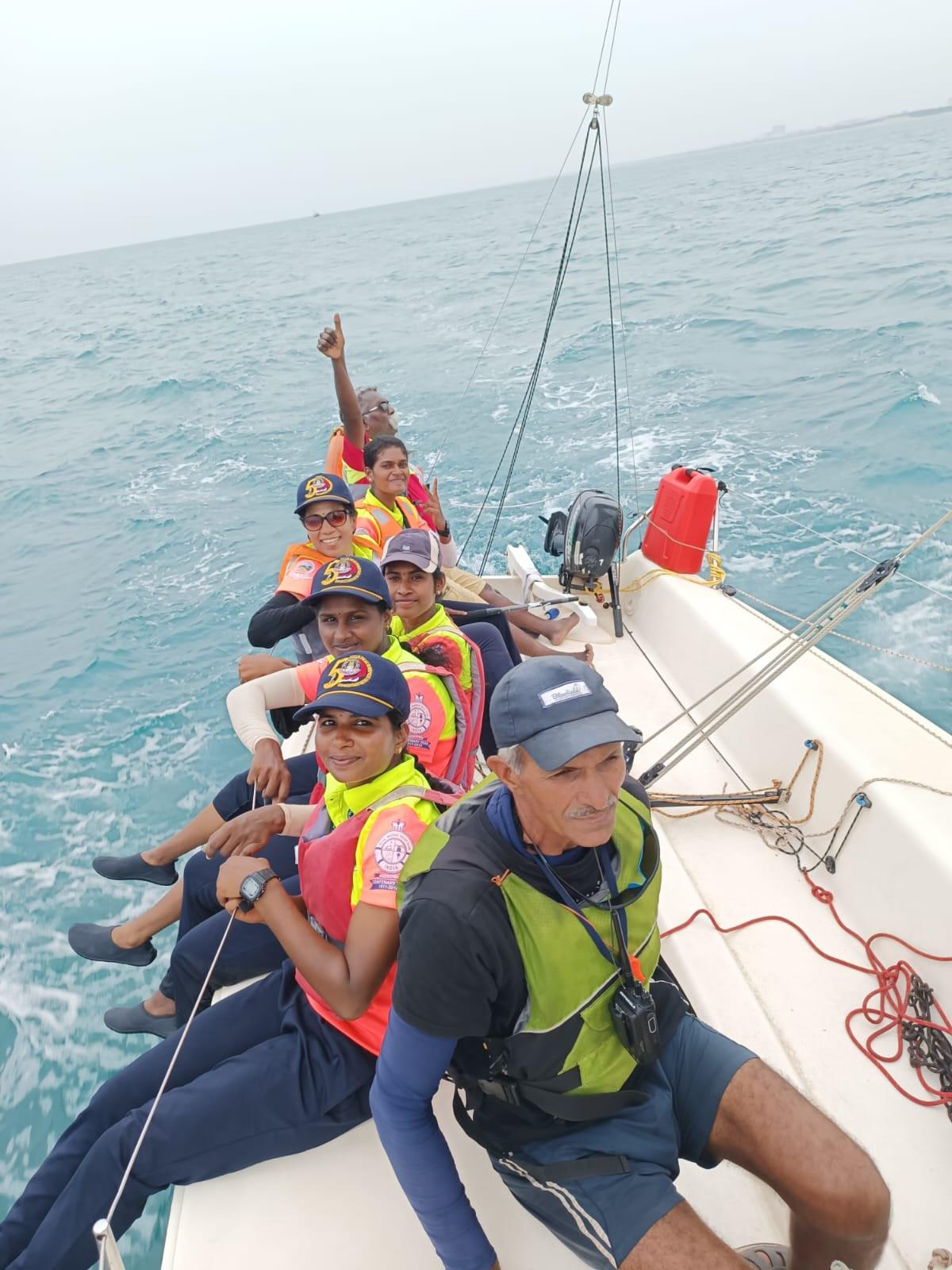 Policewomen and their coaches aboard one of the J80 sailboats 