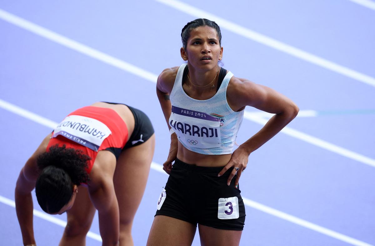 Jyothi Yarraji reacts after competing in heat 4. 