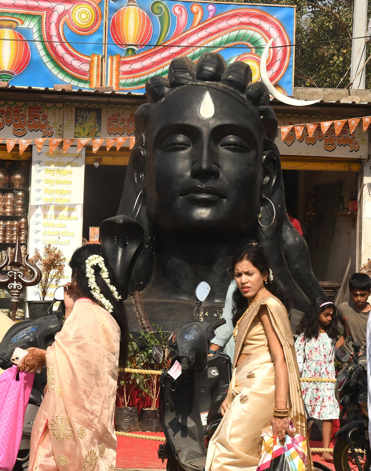 Devotees offering prayers to Lord Siva on the occasion of Maha Sivratri at Rampally X Road, in Hyderabad, on Friday. 