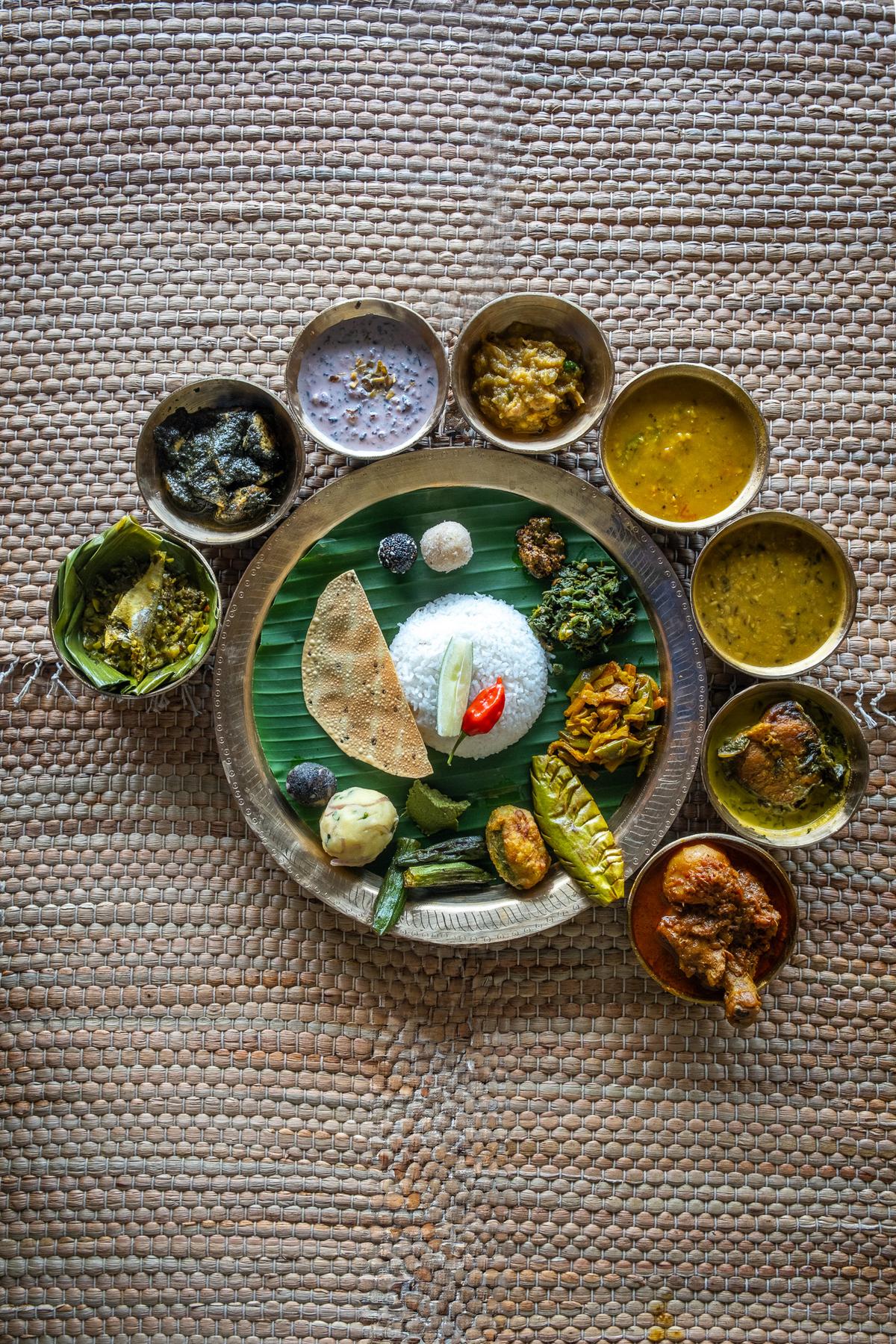 The Assamese thali served in kahor kahi-bati (handmade traditional dineware made of bell metal)