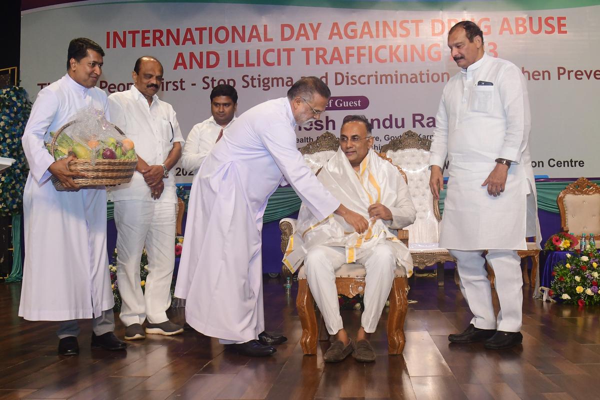 Health  and Family Welfare Minister Dinesh Gundu Rao being felicitated during at an anti-drug day programme at Father Muller Medical College, Kankanady, in Mangaluru on Friday.