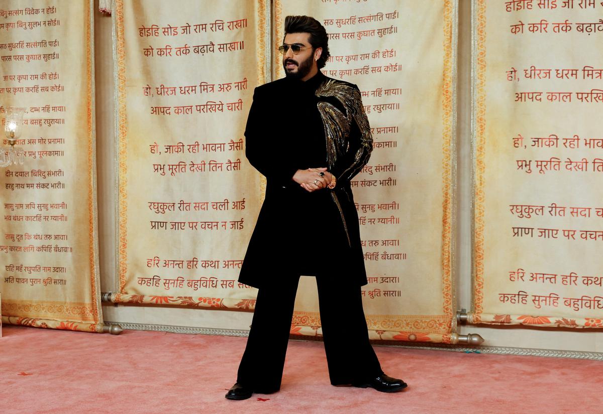 Bollywood actor Arjun Kapoor poses for pictures on the red carpet as he attends the wedding reception of Anant Ambani and Radhika Ambani after their marriage in Mumbai, India, July 14, 2024