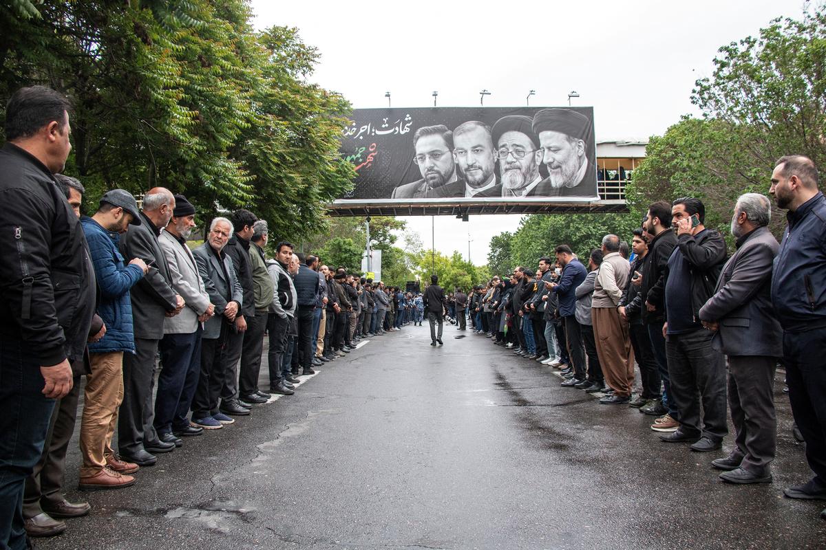 People attend a funeral ceremony for the late Iranian President Ebrahim Raisi in Tabriz, East Azerbaijan Province, Iran, May 21, 2024. 