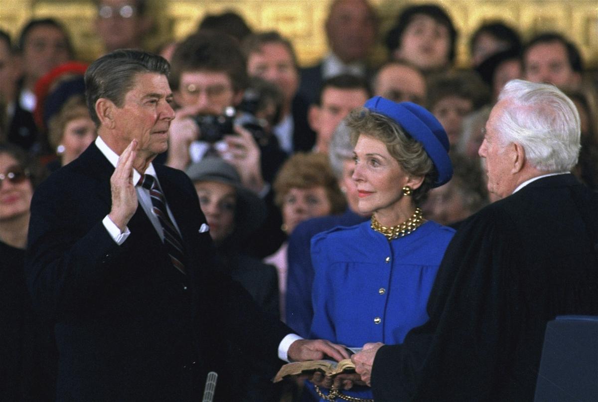 First lady Nancy Reagan, center, looks on as President Ronald Reagan is sworn in during ceremonies in the Rotunda beneath the Capitol Dome in Washington on January 21, 1985.  First lady Nancy Reagan, center, looks on as President Ronald Reagan is sworn in during ceremonies in the Rotunda beneath the Capitol Dome in Washington on January 21, 1985.