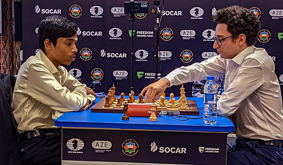 Fabiano Caruana signing the chess boards! #chess #FIDEWorldCup