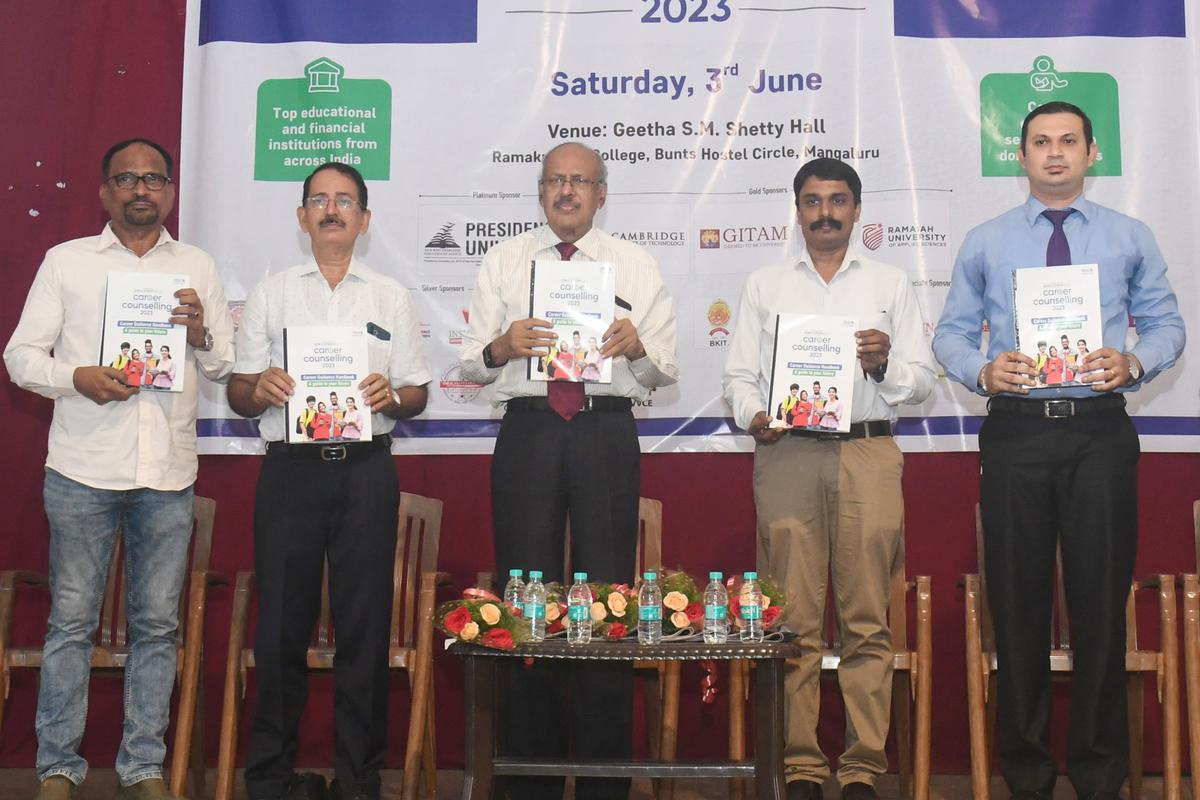 Dr. Sanjeeva Rai (3rd from Left), Correspondent, Sri Ramakrishna Educational Institution, along with other guests, releasing the Career Guidance Handbook 2023 during The Hindu CET counselling programme at Ramakrishna College, Bunts Hostel, in Mangaluru on Saturday.