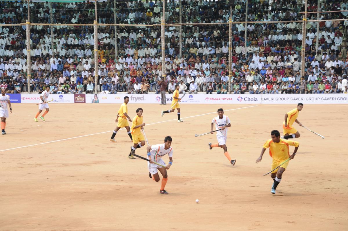 A file photo of an exhibition match between India XI and Kodagu XI, during the 16th edition of the family hockey tournament ‘Iychettira Hockey Cup 2012’, hosted by the Iychettira family, at Ammathi (South Kodagu), on April 21, 2012.