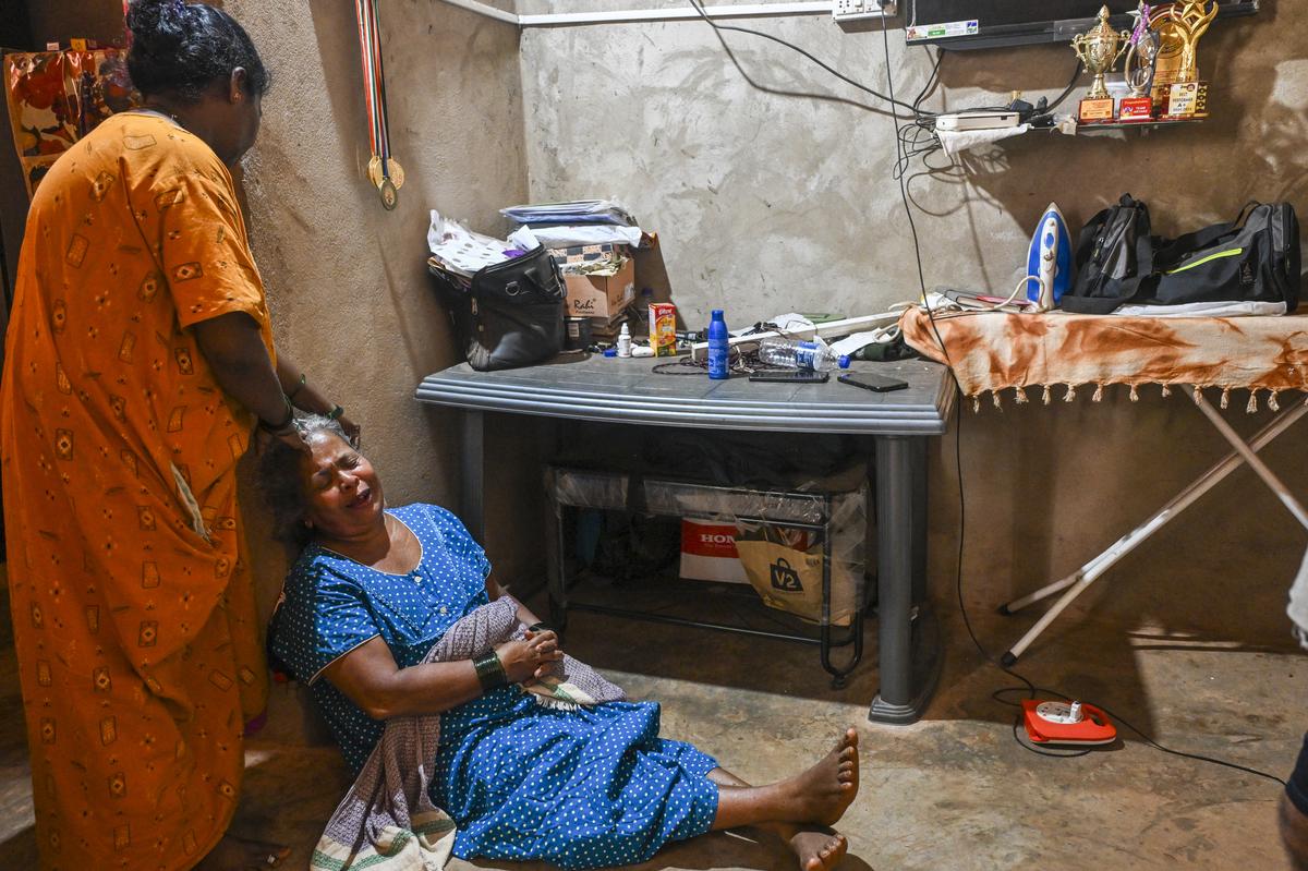 Sonia Nandadurgi, whose son Sagar Shivkumar Nandadurgi died in the stampede at the temple. 