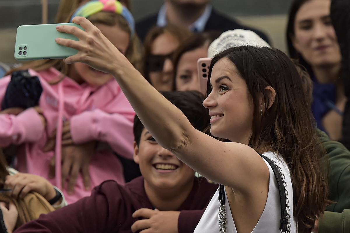 Actress Ana de Armas takes a selfie with fans as she arrives at the 70th San Sebastian Film Festival, in San Sebastian, northern Spain