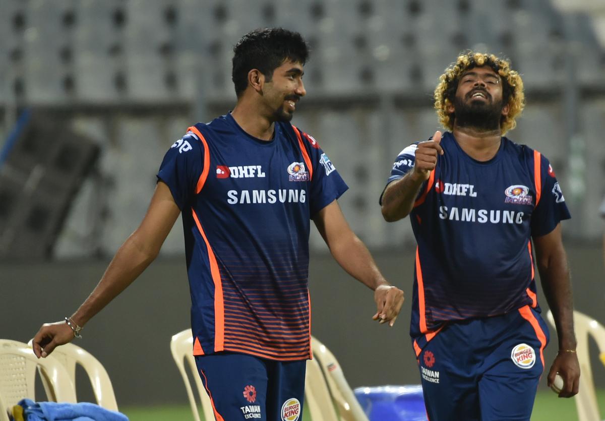 Mumbai Indians’ Lasith Malinga (right) gives tips to Jasprit Bumrah during the practice session at Wankhede Stadium in Mumbai, ahead of IPL 2018. 