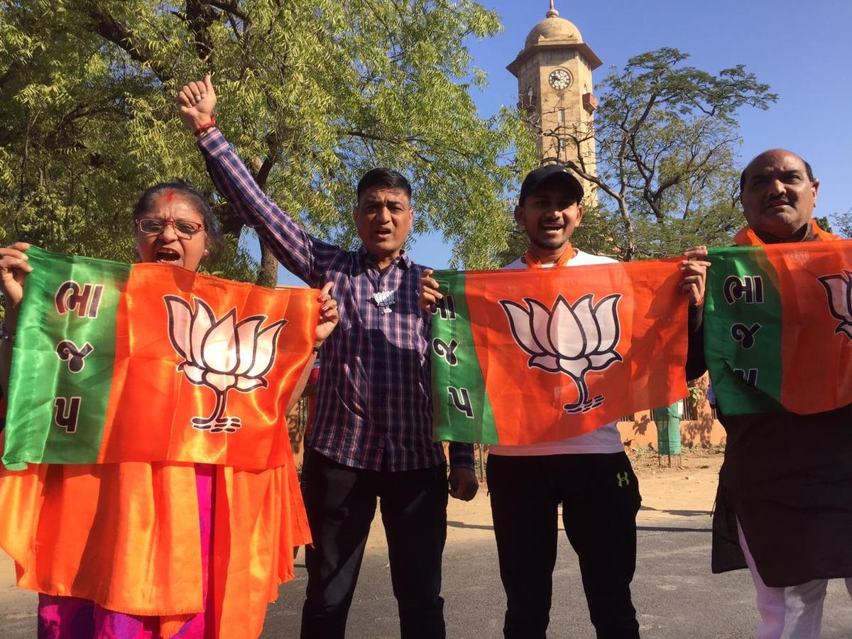 Bjp supporters outside L.D. College in Ahmedabad during the counting of votes for 182 Assembly seats in Gujarat.