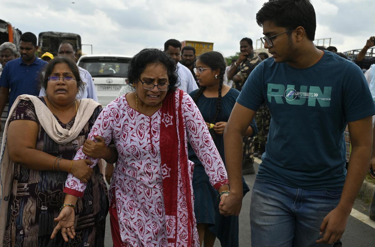 Family members grieve the death of a loved one in the accident. Family members grieve the death of a loved one in the accident.