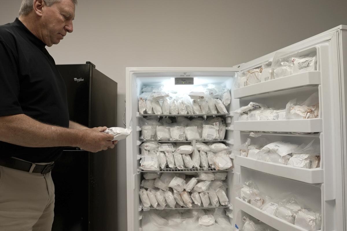 David Ayares, president and chief scientific officer of Revivicor, holds a package of frozen meat during an interview at the company’s offices in Blacksburg, May 30, 2024. His company genetically modified pigs, known as GalSafe pigs, so they no longer carry a sugar responsible for alpha-gal syndrome, an allergy to red meat.