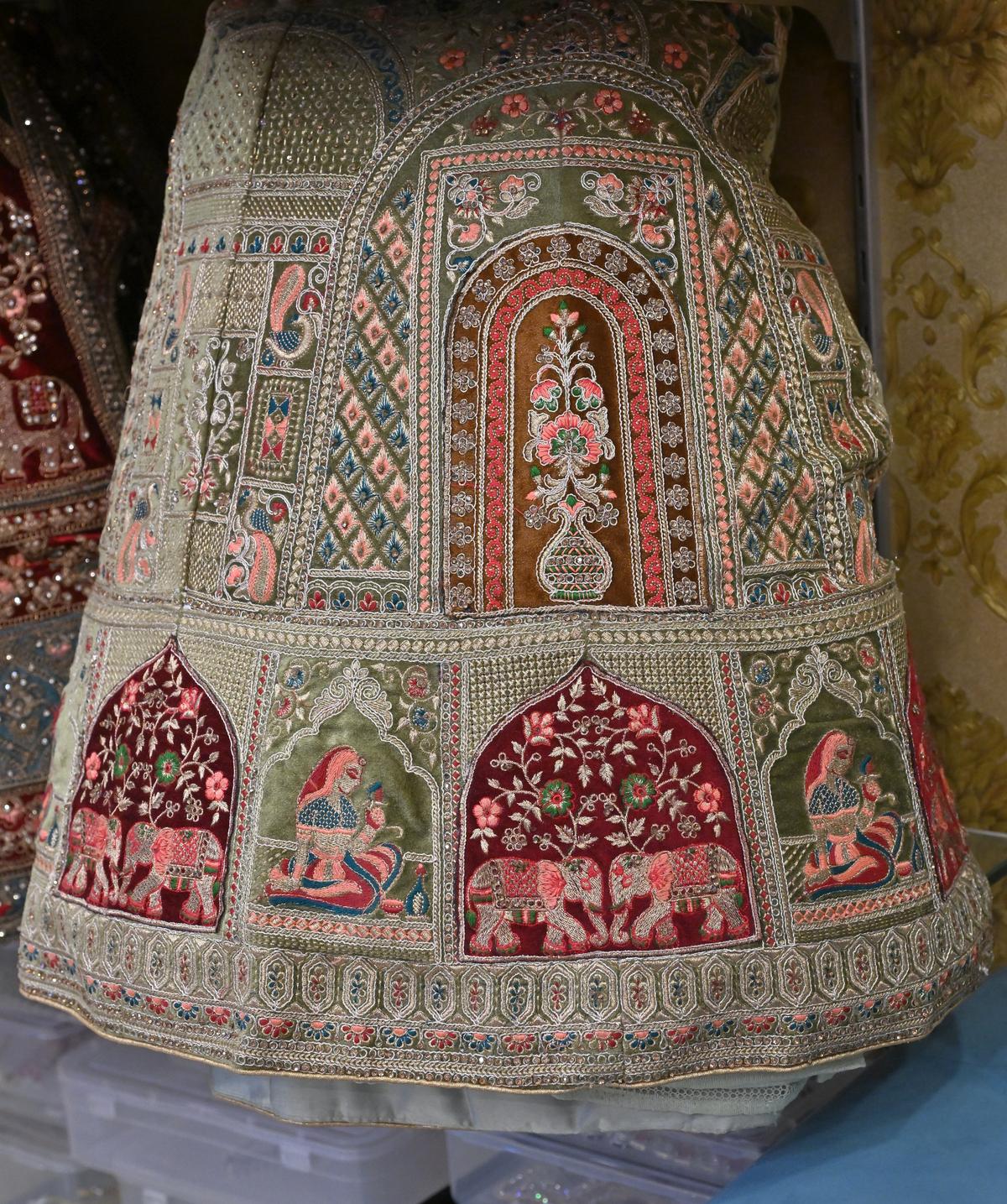 Heavily worked lehengas in vibrant tones on display at Sasha The Bridal Rental Boutique in Madurai. 