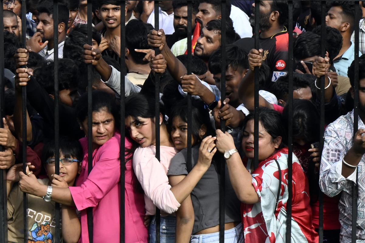 Fans during the RCB victory celebration at the Vidhana Soudha in Bengaluru on June 4, 2025.
