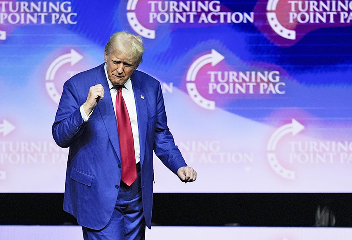 Republican Presidential nominee former President Donald Trump dances on stage after speaking during a campaign rally in Las Vegas. 