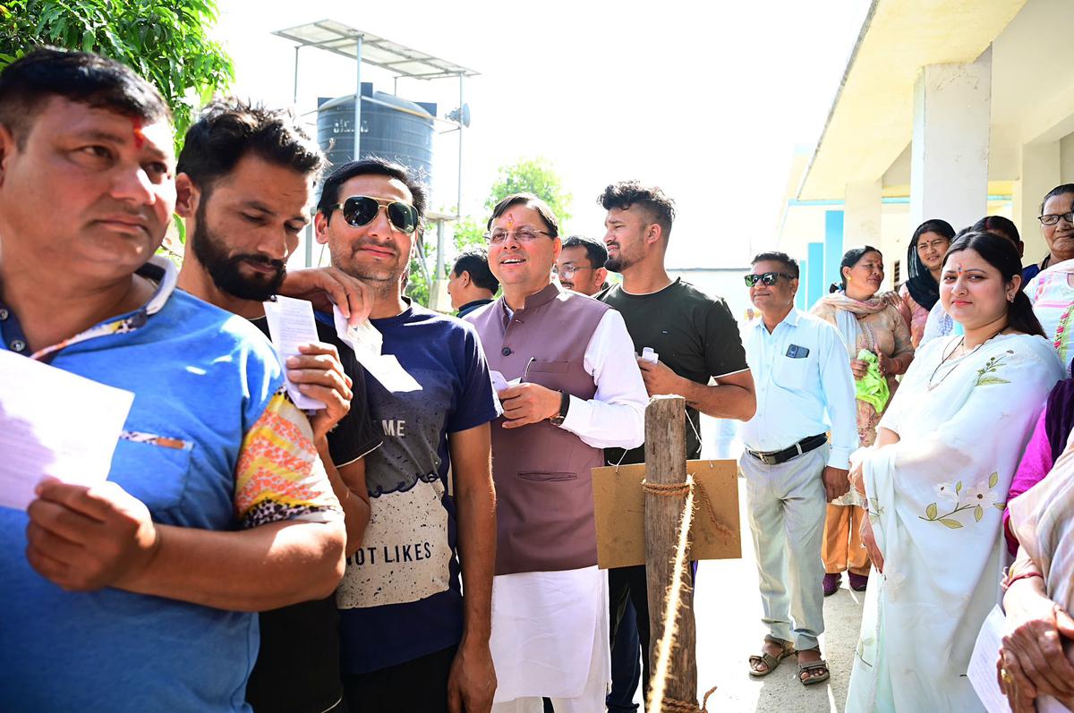 Uttarakhand Chief Minister Pushkar Singh Dhami waiting to cast his vote at the Nagra Tarai polling station in Khatima on April 19, 2024.