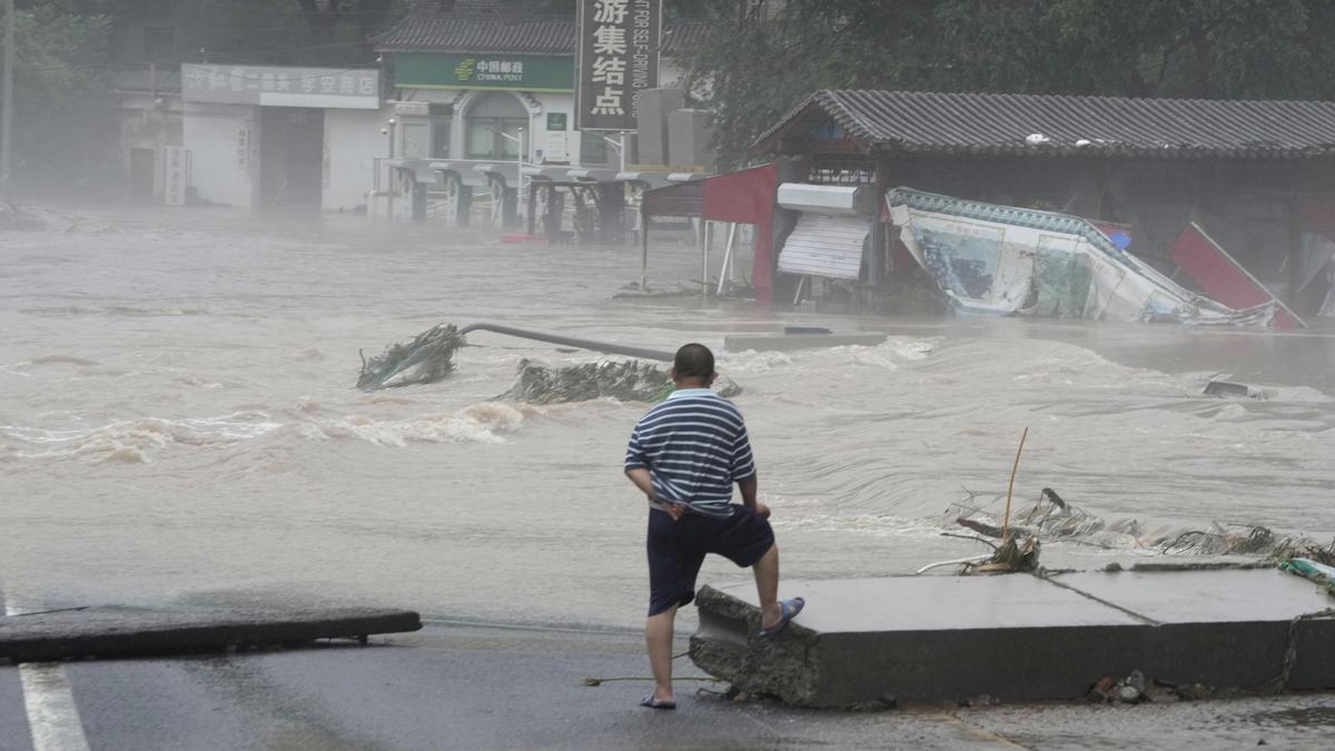 Deadly flooding in China worsens as rescue work continue and areas downriver brace for high water