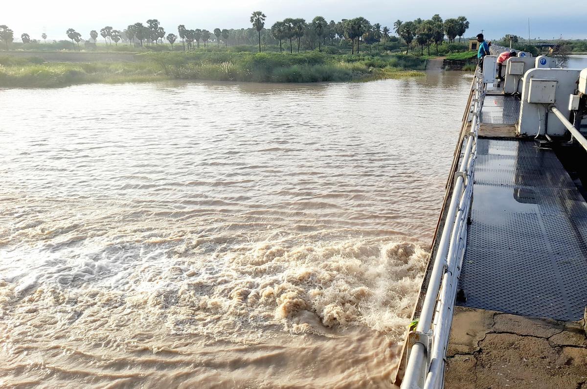 Water being released from Korampallam tank in Thoothukudi on Sunday. 