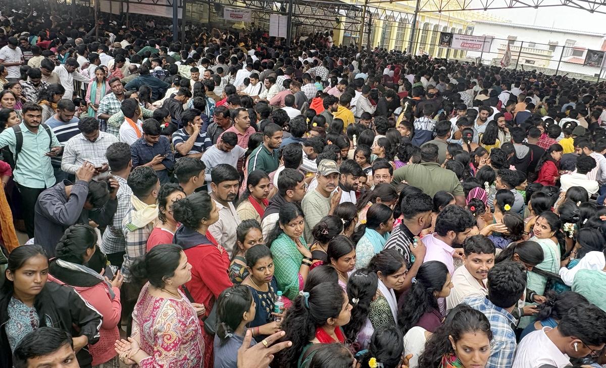 A large number of devotees standing in a long queue atop the Chamundi Hills in Mysuru on the occasion of the first Friday of Ashada month.