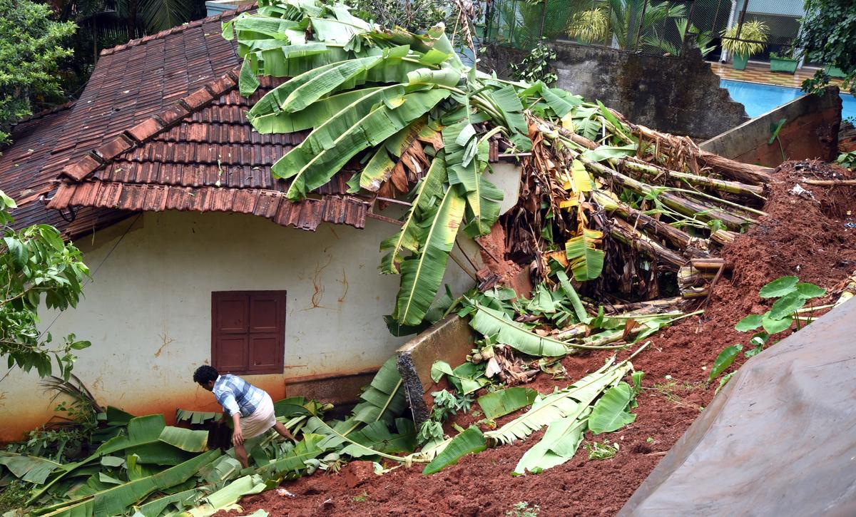 One of the houses that was damaged after a tall compound wall collapsed in the rain at Kottooli in Kozhikode on Tuesday.