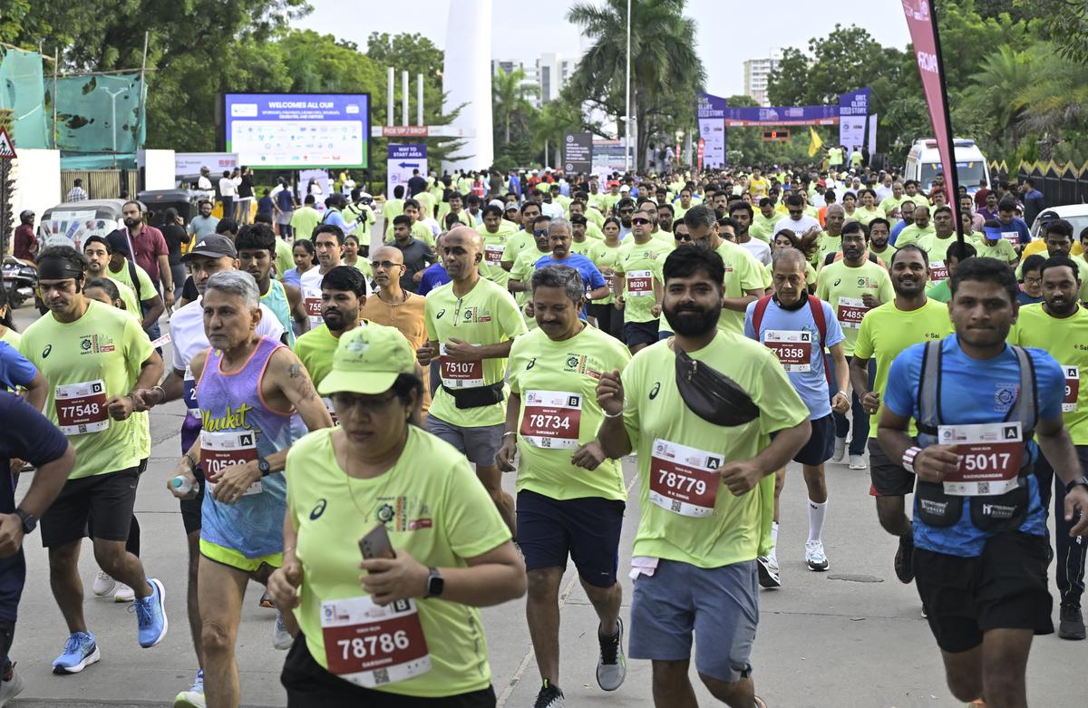 Runners in action during the 14th edition of the NMDC Hyderabad Marathon in Hyderabad on Saturday.