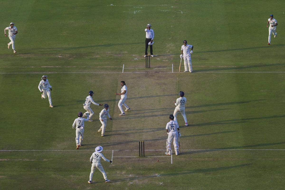 Maharashtra’s Jalaj Saxena celebrates the wicket of Abhilash Shetty.