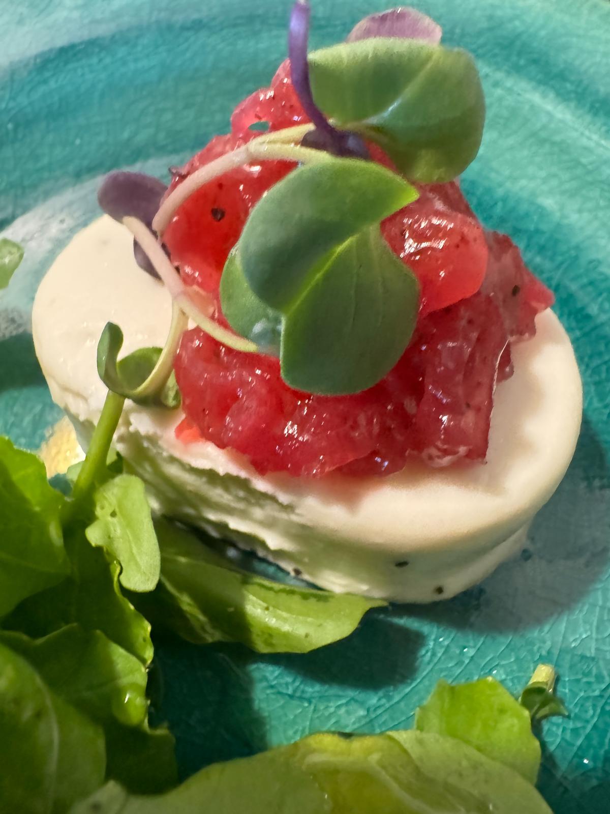 Goat cheese mousse on a pearl millet cracker 