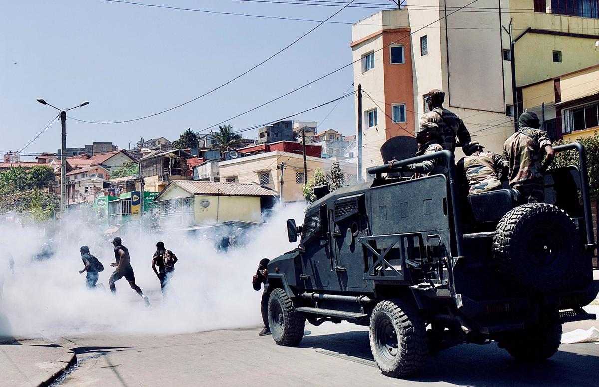 Malagasy riot police use tear gas to disperse protesters during a demonstration against frequent power outages and water shortages, near the University of Antananarivo, Madagascar on September 29, 2025. 