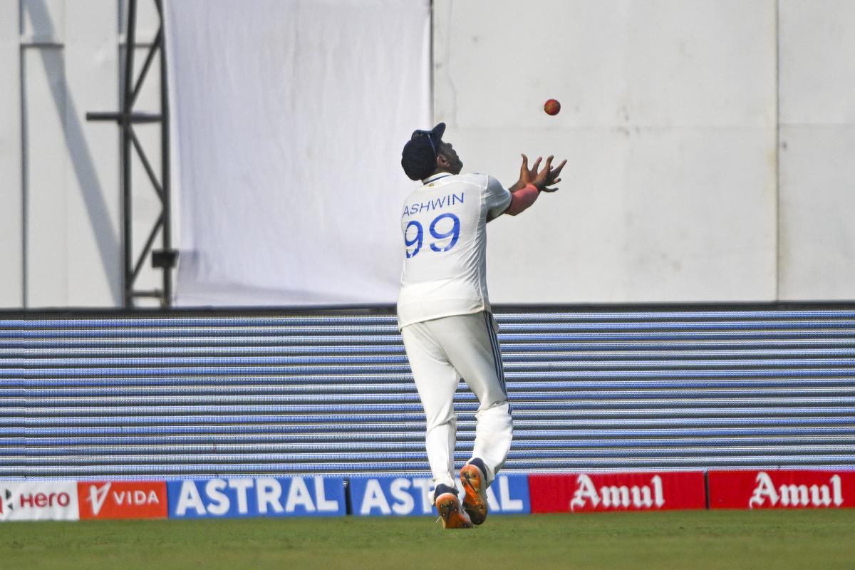 Sensational stuff: Ashwin keeps his eyes on the ball to take a stunning catch to dismiss Daryl Mitchell during the second day of the third Test Match between India and New Zealand at the Wankhede Stadium in Mumbai on November 2, 2024.